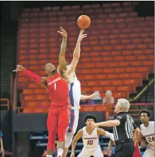  ?? COURTESY BOISE STATE ATHLETICS ?? University of New Mexico center Bayron Matos vies for the opening tip against Boise State’s Mladen Armus to start Monday night’s (Dec. 21) Mountain West Conference opener for both teams. The Lobos were dominated in the second half and lost 77-53.