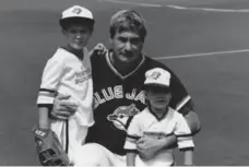  ?? COURTESY TAYLOR FAMILY ?? Dr. Ron Taylor at Exhibition Stadium with his sons Drew, left, and Matthew. Taylor, now 77, was the Jays’ doctor and occasional batting practice pitcher.