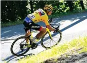  ?? THE ASSOCIATED PRESS ?? Belgium’s Greg Van Avermaet, wearing the overall leader’s yellow jersey, speeds downhill during the 10th stage of the Tour de France on Tuesday.