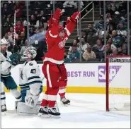  ?? TONY AVELAR — THE ASSOCIATED PRESS ?? Detroit Red Wings left wing David Perron celebrates after against San Jose Sharks goaltender James Reimer (47) during the second period of Thursday’s game in San Jose, Calif.
