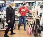  ?? Tyler Sizemore / Hearst Connecticu­t Media ?? Chris Cosenza helps Old Greenwich resident Julie Tulipane pick out a shovel at Feinsod Ace Hardware on Wednesday.