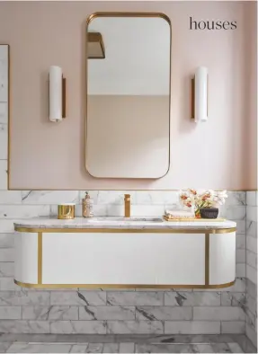  ??  ?? POWDER ROOM
Pink walls are offset with marble tiles that flow from the wall down on to the floor.
Brass-inlaid and Oniciata marble unit and mirror by Greg Natale; made by Ciolino Constructi­ons