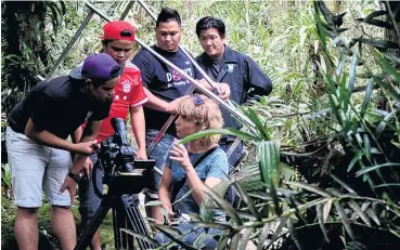  ?? PHOTO: ISMAIL GHAZALLY ?? Taking direction . . . Wiebke Finkler, of the University of Otago, directs students from University College Sabah Foundation filming in Kinabalu Park.