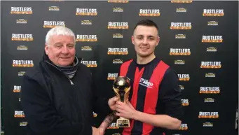  ??  ?? IT Sligo’s Michael Guilfoyle receives the man of the match award after the game.