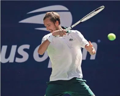  ?? ELISE AMENDOLA/AP ?? Daniil Medvedev returns a shot to Botic van de Zandschulp during their U.S. Open quarterfinal match Tuesday in New York. Medvedev won 6-3, 6-0, 4-6, 7-5.