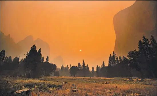  ?? Brian van der Brug Los Angeles Times ?? THICK SMOKE from multiple forest fires Saturday shrouds the iconic El Capitan rock formation and granite walls of the Yosemite Valley at Yosemite National Park.