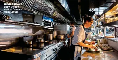  ??  ?? HigH sTeaks: Busy kitchen staff at Deane’s Meat Locker