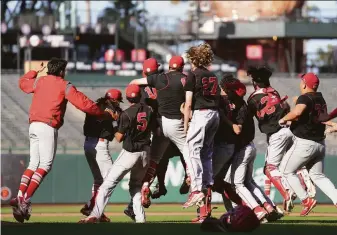  ?? Photos by Darren Yamashita / MaxPreps ?? Washington players celebrate their 6-1 defeat of Lowell in the San Francisco Section championsh­ip game at Oracle Park on Tuesday. It was Washington’s first SFS tile since 2012.