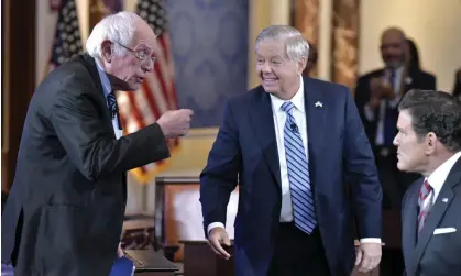  ?? Photograph: Josh Reynolds/AP ?? Bernie Sanders with Lindsey Graham and Fox host Bret Baier after the debate. Sanders he wasted no time before diving into a signature issue – universal healthcare.