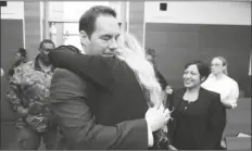  ?? DORAL CHENOWETH/THE COLUMBUS DISPATCH/AP ?? FORMER MOUNT CARMEL HEALTH DOCTOR William Husel hugs his wife, Mariah Baird, after he was found not guilty on 14 counts of murder in connection with fentanyl overdose deaths of former patients on Wednesday, in Columbus, Ohio.