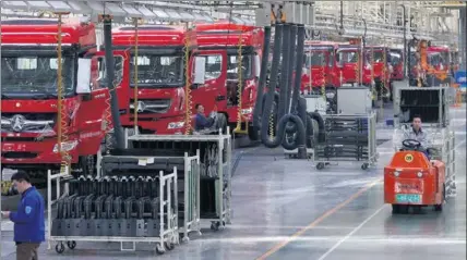  ?? PROVIDED TO CHINA DAILY ?? Heavy-duty trucks are readied for dispatch at the assembly line of a Beiben Trucks Group Co Ltd’s manufactur­ing unit.