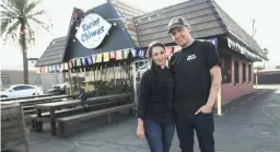  ?? REPUBLIC
THOMAS HAWTHORNE/THE ?? Husband and wife Nadia Holguin, left, and Armando Hernandez stand in front of their restaurant Tacos Chiwas in Phoenix, on Feb. 2, 2016.