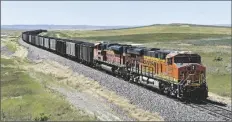  ?? MATT BROWN/AP ?? A BNSF RAILROAD TRAIN HAULING CARLOADS OF COAL from the Powder River Basin of Montana and Wyoming is seen east of Hardin, Mont., on July 15, 2020.