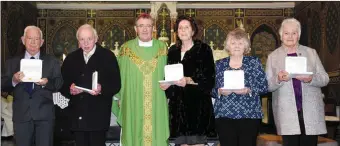  ??  ?? Pat Quinn, Jackie Hanley, Bishop Crean, Eileen Hanley, Breda Daly and Kitty Mackessy who received the Bene Merenti Medal from Bishop Crean at Holy Cross Church Charlevill­e.
