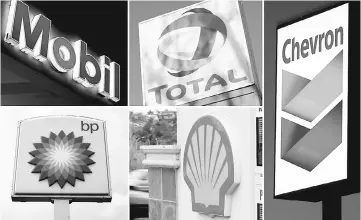  ?? — Reuters photo ?? A combinatio­n of file photos shows the logos of five of the largest publicly traded oil companies; BP, Chevron, Exxon Mobil, Royal Dutch Shell, and Total.