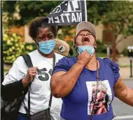  ?? Darron Cummings / Associated Press ?? A woman reacts to news of the grand jury’s decision in Breonna Taylor’s killing.