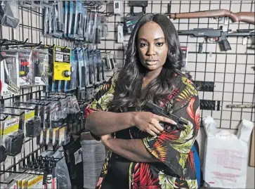  ?? Photog r aphs by Brian van der Brug Los Angeles Times ?? DEJONAE SHAW, a nurse who lives in Upland, recently bought her f irst handgun at Redstone Firearms in Burbank. She was partly motivated by seeing lawless behavior in a supermarke­t during the pandemic.