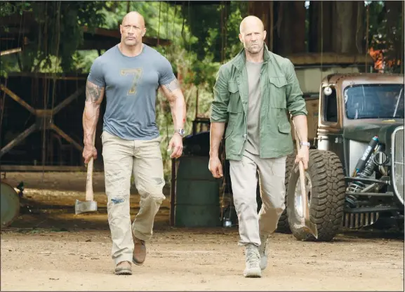  ??  ?? This image released by Universal Pictures shows Dwayne Johnson (left), and Jason Statham in a scene from ‘Fast & Furious Presents: Hobbs & Shaw’. (AP)