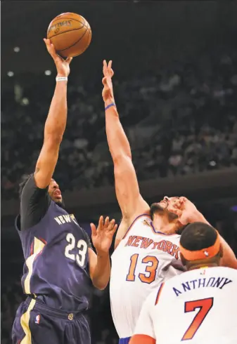  ?? Kathy Willens / Associated Press ?? New Orleans forward Anthony Davis shoots over New York’s Joakim Noah in the first half.