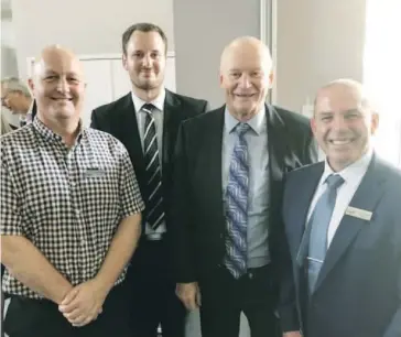  ??  ?? All smiles after hearing of the prime minister’s $2 million announceme­nt on Thursday are (from left) Cr Darren Wallace, Nick and Peter Ward of Drouin West Timber and Truss and mayor Joe Gauci.