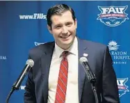  ?? JIM RASSOL/ STAFF PHOTO ?? FAU athletics director Brian White, smiling during his introducto­ry news conference in March, is said to be a driven competitor. “He’s tenacious. Everybody that knows him sees it in him,” Kevin White said of his son.