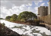  ?? AIJAZ RAHI / AP ?? Toxic froth from industrial pollution floats on Bellundur Lake in Bangalore, India, recently. Asia and Africa are putting the most people at risk, a study finds.