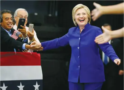  ?? (Mike Blake/Reuters) ?? US DEMOCRATIC presidenti­al candidate Hillary Clinton greets supporters at a campaign stop in Long Beach, California, on Monday.