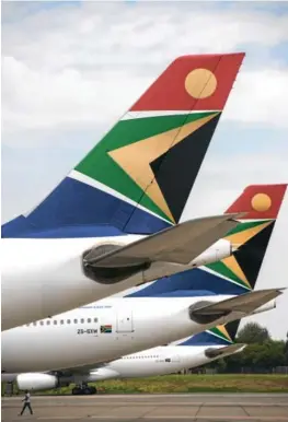  ?? Picture: WALDO SWIEGERS/BLOOMBERG ?? Three SAA aircraft are parked at OR Tambo Internatio­nal Airport. SAA owns nine aircraft, which are out to tender. Some of them were used for repatriati­on flights and food deliveries during the lockdown.