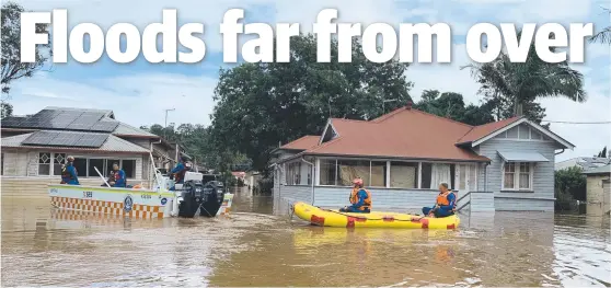  ?? Picture: Stuart Cumming ?? State Emergency Service crews inspect homes on Ewing St, Lismore, after the town’s record flood in March.