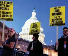  ?? — AFP photo ?? Activists in support of unionised rail workers protest outside the US Capitol Building in Washington, DC.