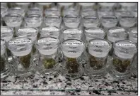  ?? AP/CARLOS OSOIRO ?? Medical marijuana sits on display Wednesday at the Far West Holistic Center dispensary in Detroit. Michigan voters Tuesday approved legalizing marijuana for recreation­al use.