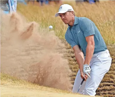  ??  ?? Jordan Spieth hits out of a bunker during the British Open on July 19.