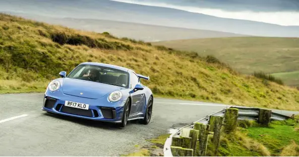  ??  ?? Above, from left: latest 991.2-gen GT3 features higher rear wing, while engine capacity is now up to 4 litres; dash is evolution of classic 911’s, just with some bigger numbers; carbonfibr­e-shelled bucket seats are a £3500 option, but well worth it
