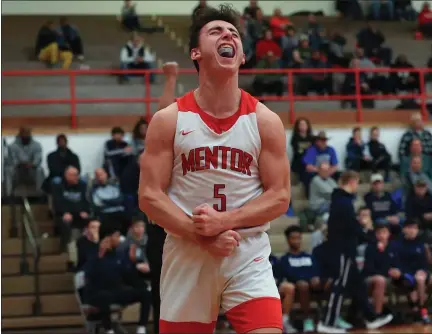  ?? TIM PHILLIS — FOR THE NEWS-HERALD ?? Mentor’s Luke Floriea celebrates his and-one layup during the first half of the Cardinals’ 74-54victory against Solon Feb. 21.