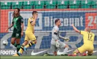  ?? (AFP) ?? Dortmund’s Portuguese defender Raphael Guerreiro (2nd left) celebrates with Dortmund’s Norwegian forward Erling Braut Haaland after scoring the opening goal against Vfl Wolfsburg in Wolfsburg on Saturday.