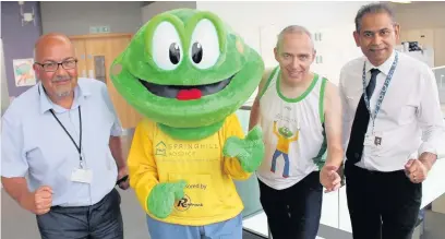  ??  ?? ●●Springy meets Rochdale council staff Rick Eckersley, John Rooney and Dilip Mistry who are taking part in the Rochdale Half Marathon and 10km in aid of Springhill Hospice