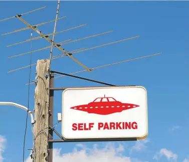  ?? Picture: Christophe­r Morris/Getty Images ?? A parking sign at a petrol station near Area 51. The land, owned by the US military, has long been associated with reports of UFO sightings and conspiracy theories.