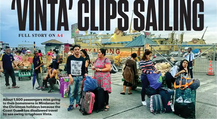  ?? SUNSTAR FOTO / ALEX BADAYOS ?? ANY STORM STOPPER OUT THERE? Travelers mull over what to do after being told that boat trips are suspended.