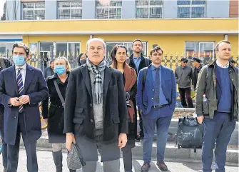  ?? REUTERS ?? Jim Nickel, charge d’affaires of the Canadian Embassy in China, and other foreign diplomats wait outside the Intermedia­te People’s Court where Michael Spavor, a Canadian detained by China on suspicion of espionage, stood trial, in Dandong, Liaoning province, China, on Friday.