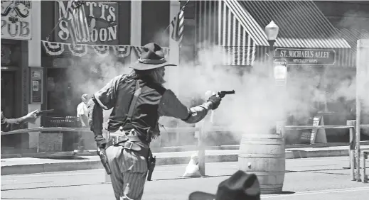  ??  ?? A Prescott Regulator joins the fight at the annual Shootout on Whiskey Row in Prescott.