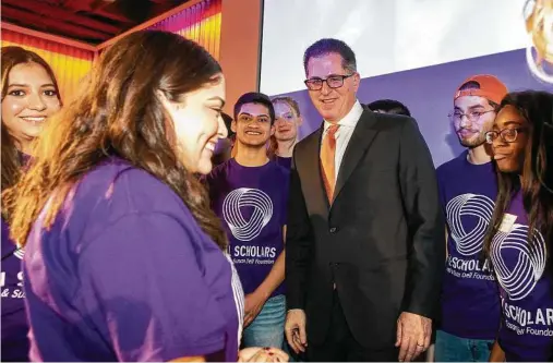  ?? Stephen Spillman / Staff file photo ?? Michael Dell meets Dell scholarshi­p recipients at the University of Texas at Austin early last year. “There are 150,000-plus students within a 100-mile radius of Austin,” he says, “which makes it very attractive for tech companies that are growing.”