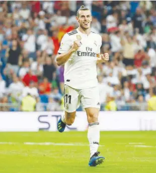  ?? Reuters ?? Real Madrid’s Gareth Bale celebrates after scoring a goal against Getafe on Sunday.