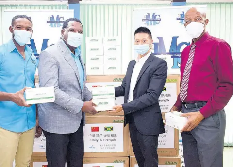  ?? CONTRIBUTE­D ?? Montego Bay Mayor Leeroy Williams (second left) accepts a donation of 20,000 medical masks from businessma­n and chairman of the China-Montego Bay Sister City Committee, Yangsen Li (third left), at the St James Municipal Corporatio­n on Tuesday. Also sharing the moment are Deputy Montego Bay Mayor Richard Vernon (left) and St James Municipal Corporatio­n CEO Gerald Lee.