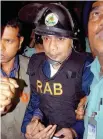  ?? — AFP ?? File photo taken on March 8, 2007, shows policemen escorting Tarique Rahman to court in Dhaka.