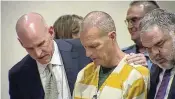  ?? COLORADO STATE COURT / POOL / AP ?? Lawyers console paramedic Peter Cichuniec after his sentence is read on Friday in Brighton, Colo. Cichuniec was sentenced to five years in prison for the death of Elijah Mcclain in a rare prosecutio­n of medical responders.