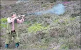  ??  ?? A POT SHOT: Malcolm Gray from Arbroath pictured on the grouse moors above Glen Clova.