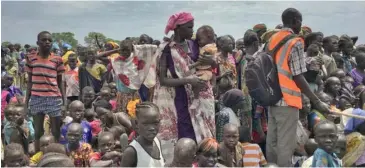  ??  ?? Men, women and children line up to be registered with the World Food Programme for food distributi­on in Old Fangak, in Jonglei state, one of the worst affected areas for food insecurity in South Sudan.