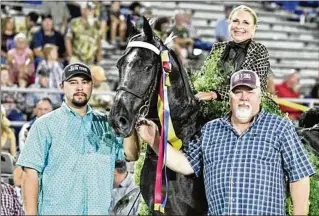  ?? COURTESY ?? Nick Price (left) and Alan Price of Price Stables persuaded Sarah Coffee Burks to come back to competitio­n after a long hiatus. She and Iron Door were crowned 2023 Amateur World Grand Champions. Nick said the world champion horse is a big pet that everyone loves to spoil.