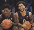  ?? MIKE DE SISTI / JOURNAL SENTINEL ?? Marquette seniors Sacar Anim (left) and Markus Howard had their careers end when the NCAA tournament was canceled.