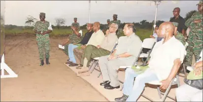  ?? (Ministry of the Presidency photo) ?? President David Granger (seated fourth from left) pays keen attention as Deputy Chief-of-Staff of the Guyana Defence Force Colonel George Lewis explains the elements of exercise ‘Homeguard.’ Minister of Foreign Affairs Carl Greenidge (seated at right),...